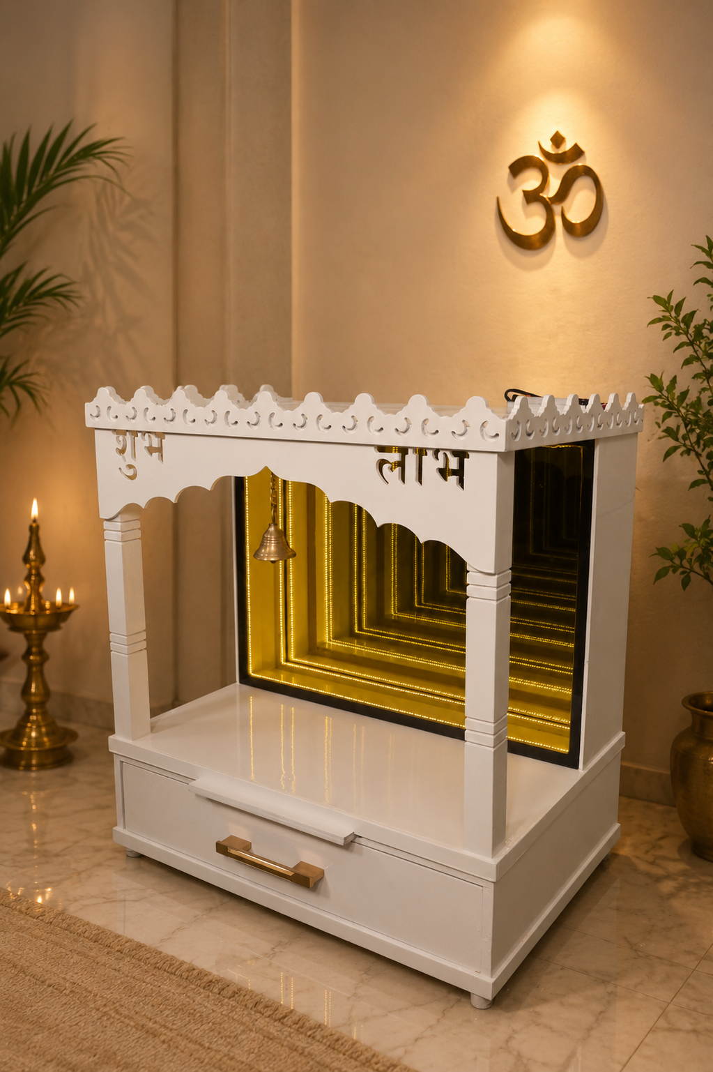 A white wooden Shiva mandir or prayer shrine with gold inner panels, brass details, and Devanagari script on the front, shown in a decorated home interior with a gold Om symbol on the wall, a brass lamp, and plants.