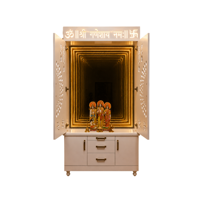 A cream-colored Shree Ganesh Hall with open doors, showcasing a golden illuminated tunnel interior and a set of four Lord Ganesha statues on a white marble top. The cabinet features gold handles and a white signboard with Sanskrit mantras at the top, set against a solid white background.